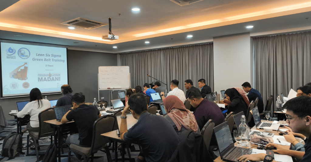 Participants attending the Lean Six Sigma Green Belt Certification Course under Program Latihan MADANI, led by MBizM Sdn. Bhd. at Acappella Suite Hotel, focused on interactive lectures and training sessions.