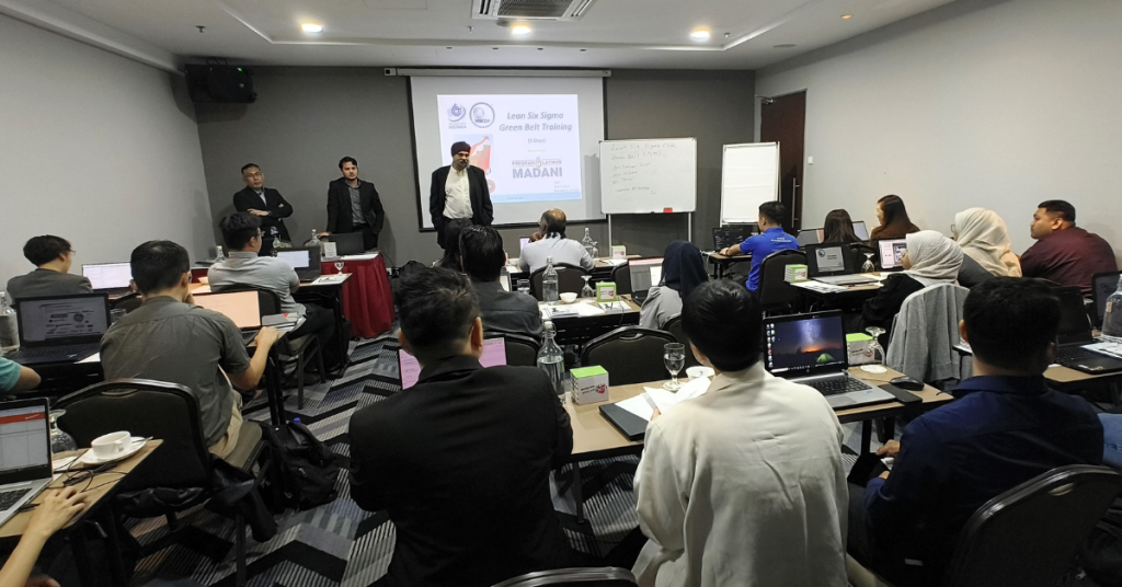 Trainers addressing participants during the Lean Six Sigma Green Belt Certification Course under Program Latihan MADANI, organized by MBizM Sdn. Bhd. at Acappella Suite Hotel.