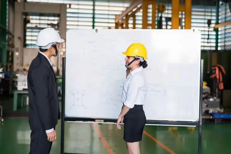 In-house Lean Six Sigma training at a manufacturing site whiteboard